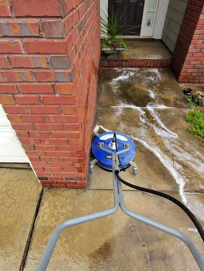 Surface cleaner cleaning a concrete entry walkway in the Columbus GA area