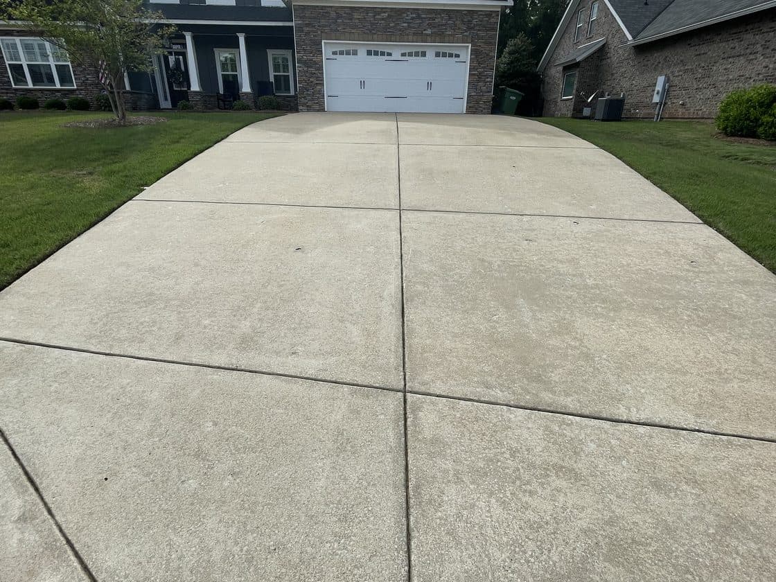 Clean concrete driveway after driveway cleaning by Team Clean in the Columbus GA area