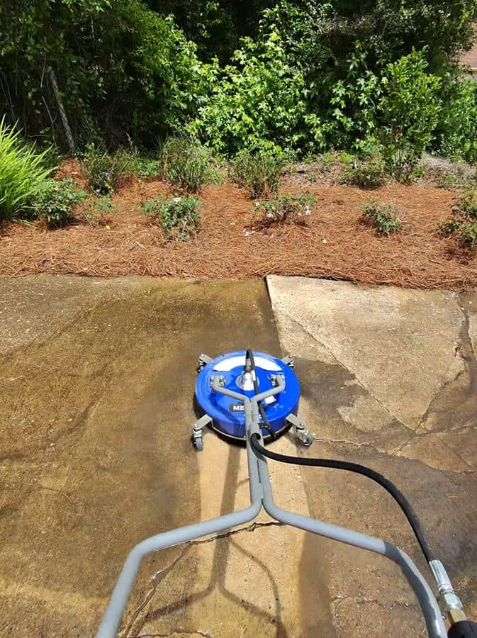 Freshly pressure-washed concrete driveway cleaned by Team Clean in the Columbus, GA area