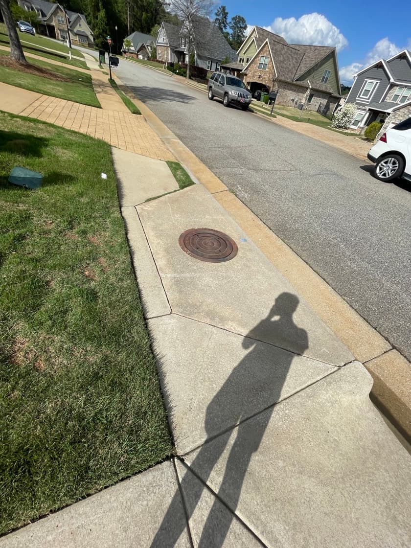 Concrete driveway and apron after pressure washing by Team Clean in the Columbus GA area